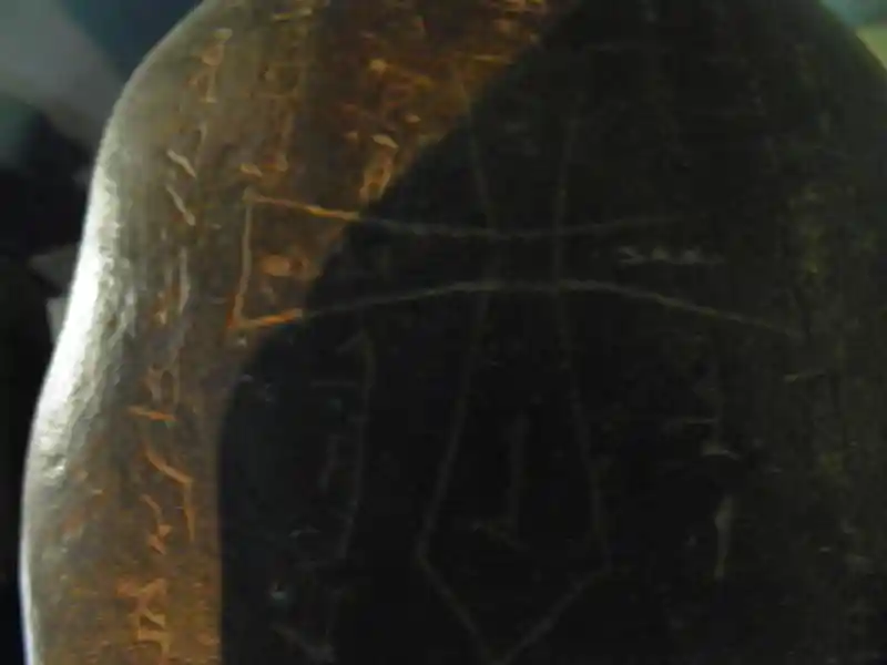 Stone with a cross surrounded by inscriptions